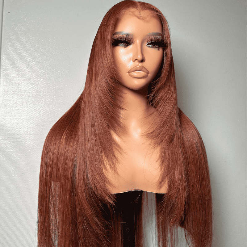 A close-up view of the layered cutting and face-framing natural cascading effects of the ALIGLOSSY Layered Cut Copper Brown Wig 13x4 HD Transparent Lace Frontal Human Hair Wigs, highlighting the gradual transition of layers.