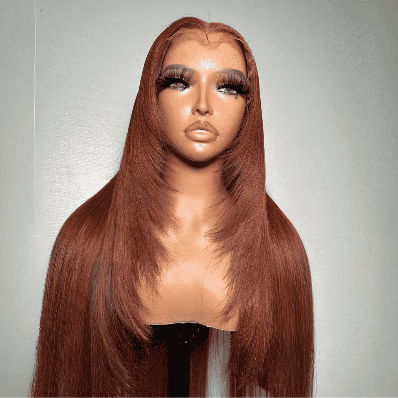 Frontal display of the ALIGLOSSY Layered Cut Copper Brown Wig 13x4 HD Transparent Lace Frontal Human Hair Wigs, showcasing its rich warm copper tone, natural cascading face-framing layers, and soft straight texture worn by a model.