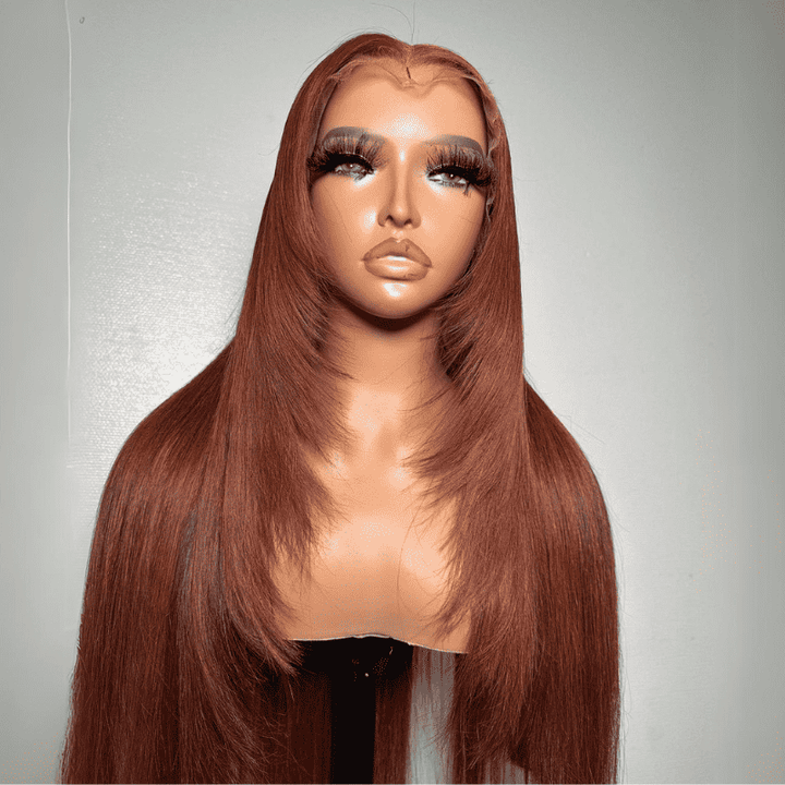 Frontal display of the ALIGLOSSY Layered Cut Copper Brown Wig 13x4 HD Transparent Lace Frontal Human Hair Wigs, showcasing its rich warm copper tone, natural cascading face-framing layers, and soft straight texture worn by a model.